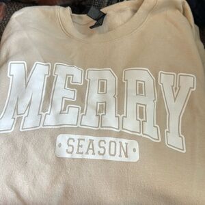 Large beige holiday sweatshirt